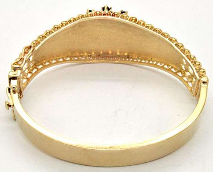 LADIES 14 KT YELLOW GOLD BANGLE BRACELET.