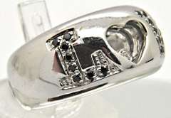 LADIES 18 KT WHITE GOLD DIAMOND 'LOVE' RING.