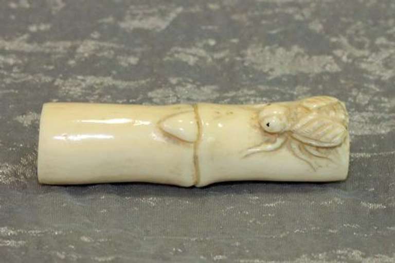 Hand-carved Fly on Bamboo