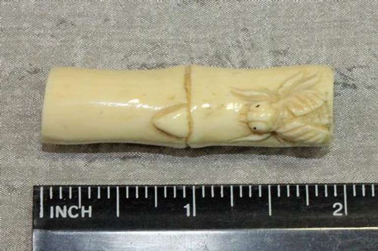 Hand-carved Fly on Bamboo