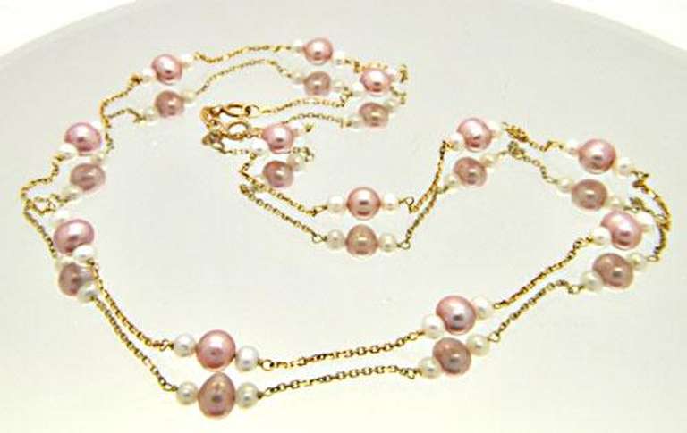 LADIES 14 KT YELLOW GOLD PEARL STATION NECKLACE.