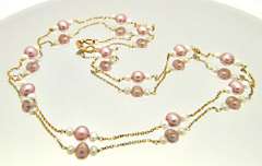 LADIES 14 KT YELLOW GOLD PEARL STATION NECKLACE.