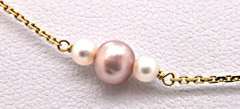 LADIES 14 KT YELLOW GOLD PEARL STATION NECKLACE.