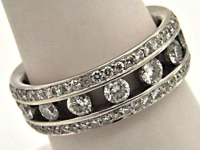 LADIES 18KT WHITE GOLD DIAMOND BAND.