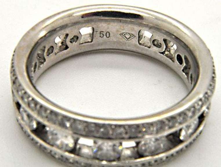 LADIES 18KT WHITE GOLD DIAMOND BAND.