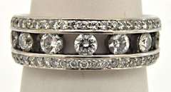LADIES 18KT WHITE GOLD DIAMOND BAND.