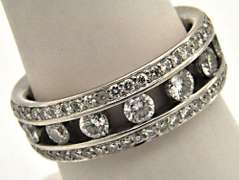 LADIES 18KT WHITE GOLD DIAMOND BAND.