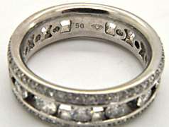 LADIES 18KT WHITE GOLD DIAMOND BAND.