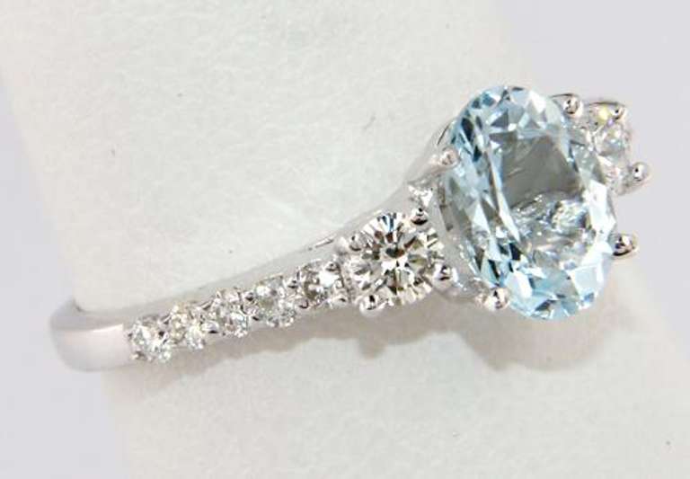 Stylish Aquamarine and Diamond Shared Prong Ring