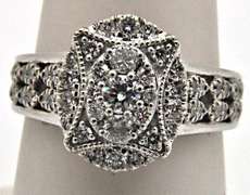 14KT WHITE GOLD DIAMOND RING.