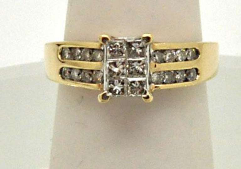 10K YELLOW GOLD LADIES DIAMOND RING.