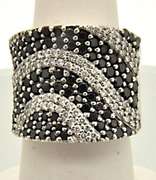 LADIES 14K WHITE GOLD BAND WITH 1.50 CARAT OF DIAMONDS.