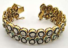 STERLING SILVER, GOLD, DIAMOND AND EMERALD BRACELET.