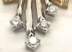 14K TWO TONE GOLD AND DIAMOND SLIDE PENDANT.