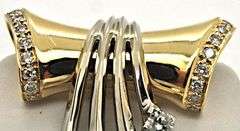 14K TWO TONE GOLD AND DIAMOND SLIDE PENDANT.