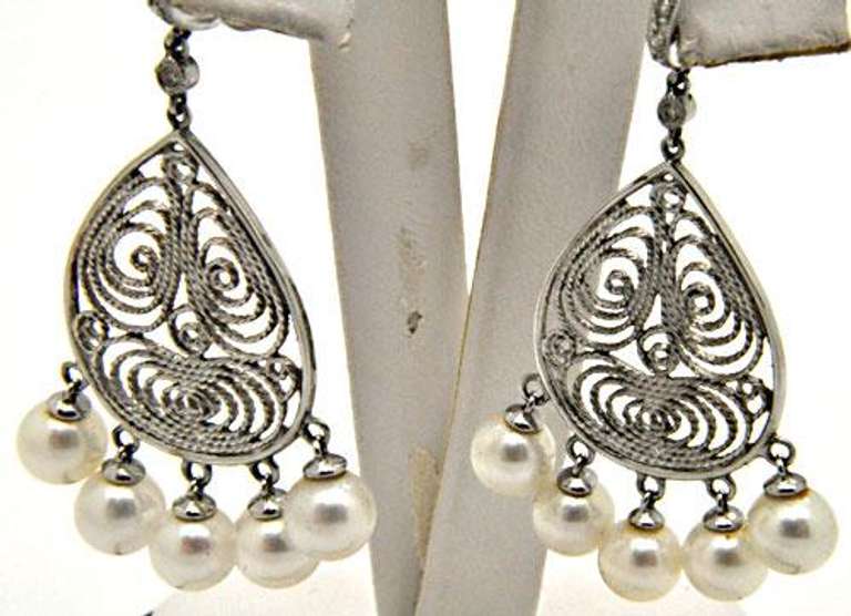 6MM CULTURED PEARL AND DIAMOND CHANDELIER EARRINGS.