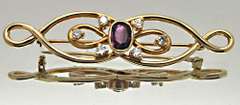 14 KT YELLOW GOLD BROOCH WITH TOURMALINE AND DIAMONDS.