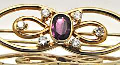 14 KT YELLOW GOLD BROOCH WITH TOURMALINE AND DIAMONDS.