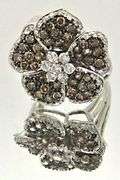 LADIES 14 KT WHITE GOLD FLOWER DIAMOND RING.