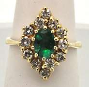 14 KT YELLOW GOLD EMERALD AND DIAMOND RING.