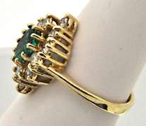 14 KT YELLOW GOLD EMERALD AND DIAMOND RING.