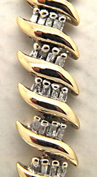 LADIES 14 KT YELLOW GOLD DIAMOND BRACELET.