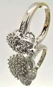 LADIES 14 KT WHITE GOLD DIAMOND CLUSTER RING.