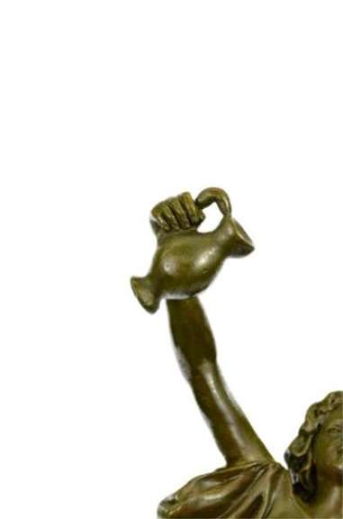 Bronze Sculpture Depicting a lady Holding Jug of Wine