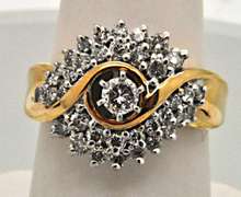 LADIES 14KT YELLOW GOLD DIAMOND CLUSTER RING.