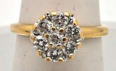 LADIES 14 KT YELLOW GOLD DIAMOND CLUSTER RING.