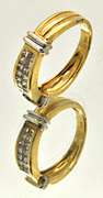 LADIES 14 KT YELLOW AND WHITE GOLD DIAMOND BAND.