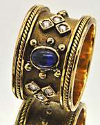 LADIES 18 KT YELLOW GOLD BLUE CABOCHON SAPPHIRE SET.