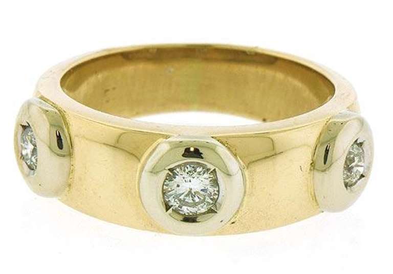Three Dazzling Bezel Set Round Cut Diamonds