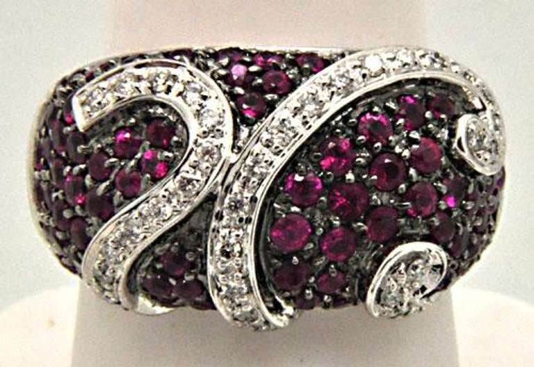 LADIES 18 KT WHITE GOLD RUBIES AND DIAMOND RING.