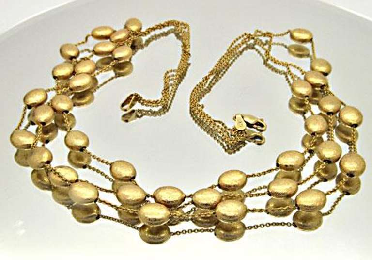 14 KT SOLID GOLD STATION NECKLACE.