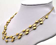 14 KT SOLID GOLD STATION NECKLACE.