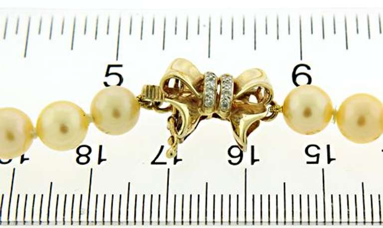 Golden Peach Pearl Necklace with Bow Clasp & Spacers