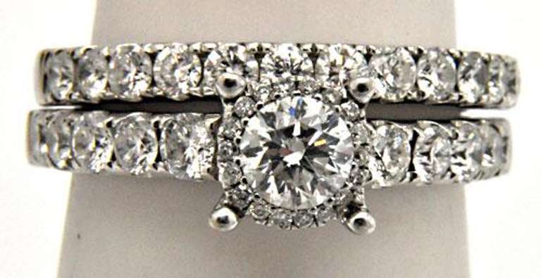 LADIES 14KT WHITE GOLD DIAMOND WEDDING BAND.