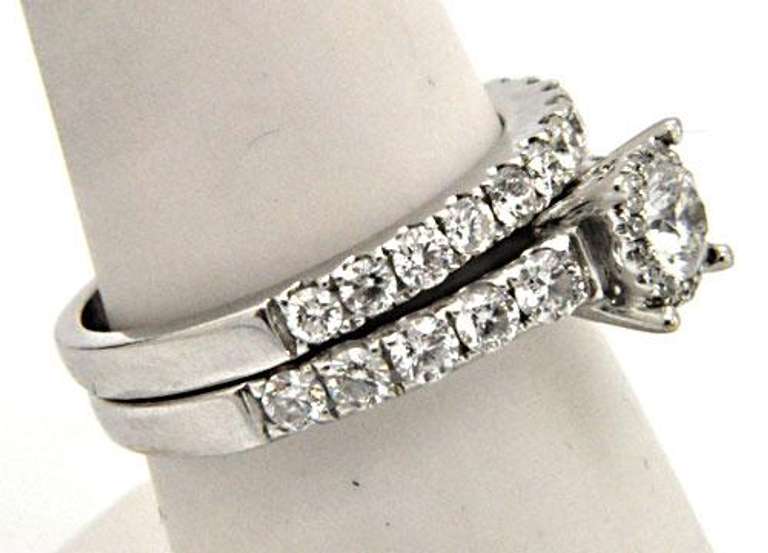 LADIES 14KT WHITE GOLD DIAMOND WEDDING BAND.
