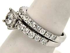 LADIES 14KT WHITE GOLD DIAMOND WEDDING BAND.