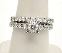 LADIES 14KT WHITE GOLD DIAMOND WEDDING BAND.