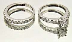 LADIES 14KT WHITE GOLD DIAMOND WEDDING BAND.