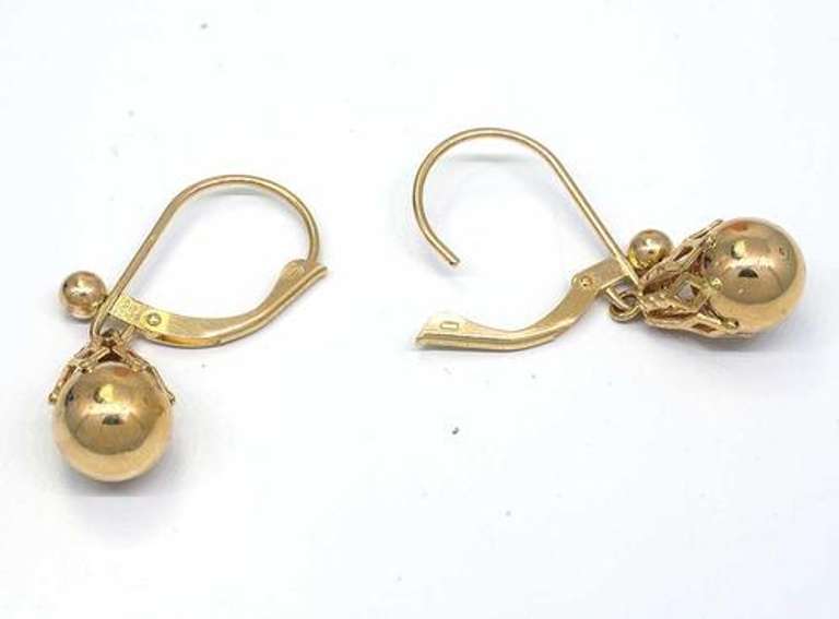 Ornate Dangling Gold Bead Earrings