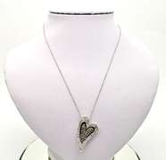 14KT GOLD HEART PENDANT/W WHITE AND CHOCOLATE DIAMONDS.