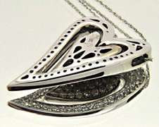 14KT GOLD HEART PENDANT/W WHITE AND CHOCOLATE DIAMONDS.
