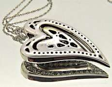 14KT GOLD HEART PENDANT/W WHITE AND CHOCOLATE DIAMONDS.