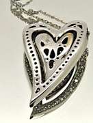 14KT GOLD HEART PENDANT/W WHITE AND CHOCOLATE DIAMONDS.