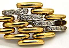 18KT YELLOW AND WHITE GOLD DIAMOND LINKS EARRING.