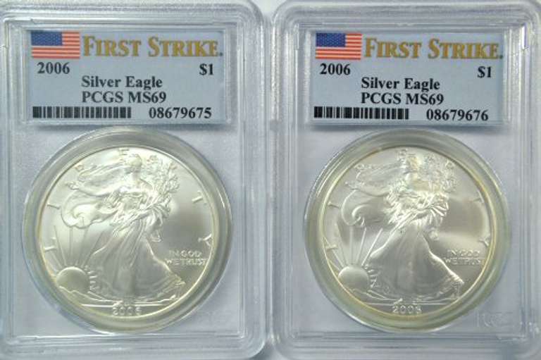 Two 2006 First Strike $1 Silver Eagles. PCGS MS69