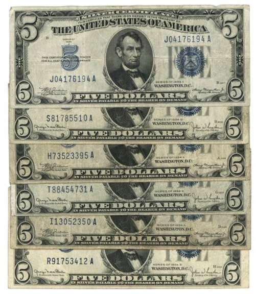 One 1928 $5 Red & Four 1934 Blue Seal $5 Notes. Nice